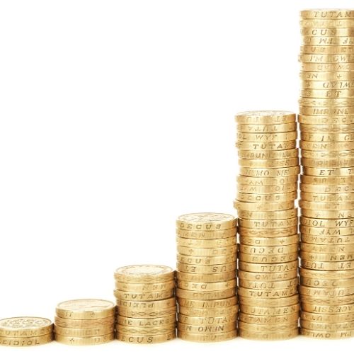 Image shows a stack of pound coins to illustrate finance. 